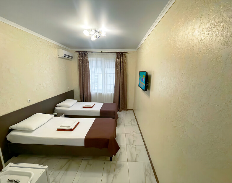 Фото номера Стандарт двухместный с двумя кроватями 3